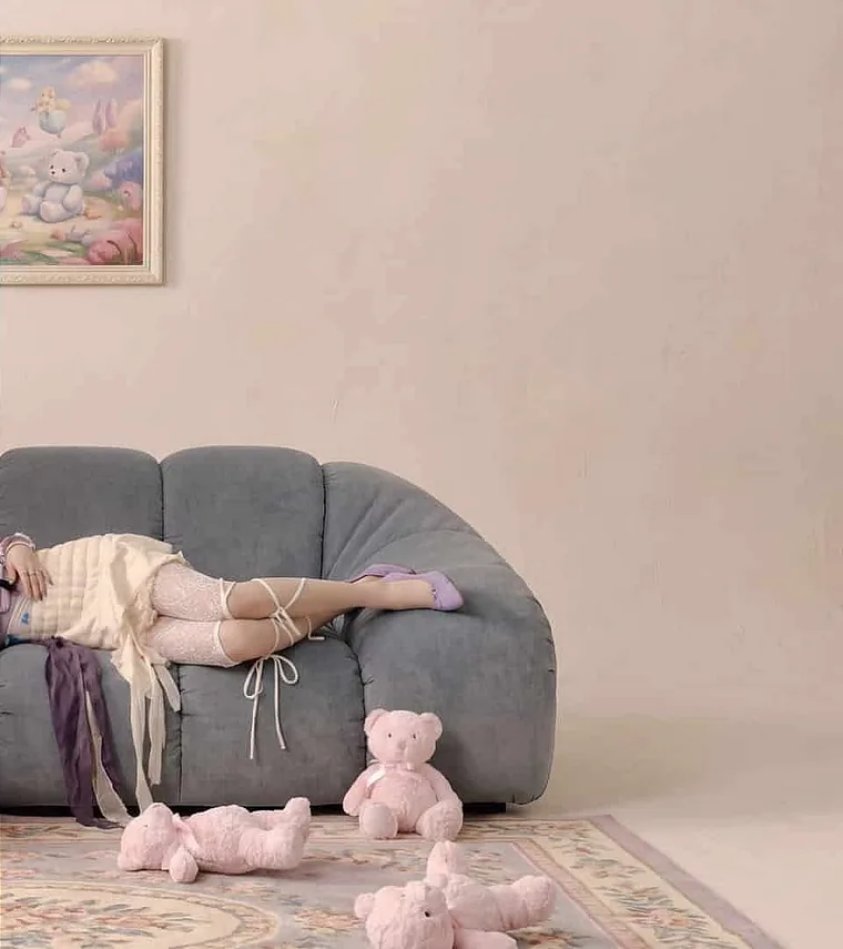 Photo of a person on a sofa in a real living room